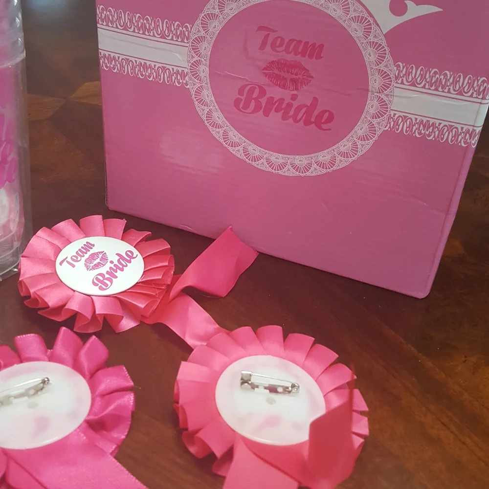 Team bride. Cups and lapel pins.